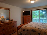 queen bedroom with door to north deck