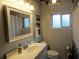 Newly Renovated bathroom off of east bonus room with fold flat sofa